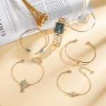 Code: CH-2627 Gold 5-Piece Iced-Out Women's Watch & Bracelet Set Stylish Diamond Design for a Glamorous Touch - Image 3